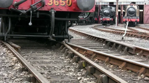 Pannier tank steam engine 3650 passes by to reveal engine shed trains at Didcot Stock Footage 60127084