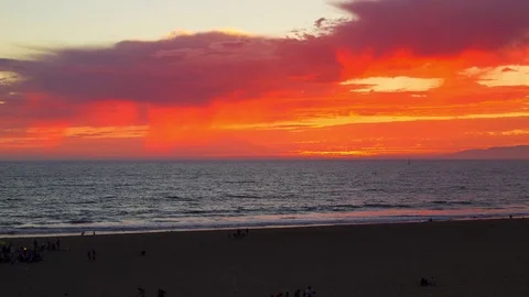 Panning Across The Beach Between Day and Night with Colorful Sunset Video stock 76633894