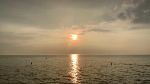 Panning across beach on summer evening Stock Footage 112268051