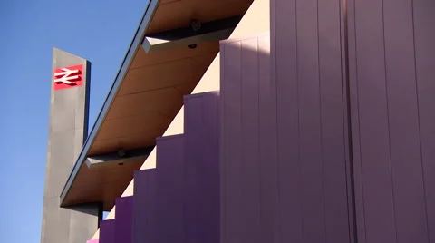 Panning Across Building to Train Station Sign Stock Footage 61607323