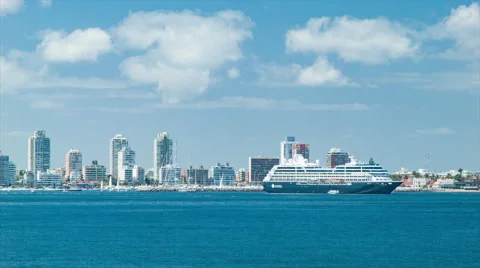 Panning Across Punta del Este City Skyline with Cruise Ship Video stock 61085765