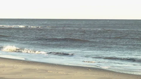 Panning across Quiet Beach at Sunset with no people Stock Footage 185096113