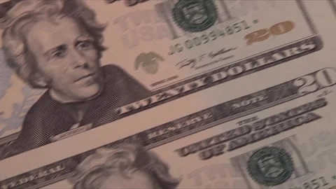 Panning across sheet of 20 dollar bills Video stock 138968454