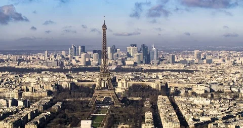Panning aerial time lapse view of the Eiffel tower and La Defense in Paris Stock Footage 71157223