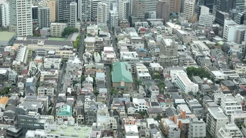 Panning aerial view of dense urban cityscape from above Stock-Footage 341786877