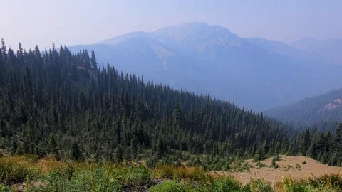 Panning along the olympic mountain range in washington state on windy day Stock Footage 100448046