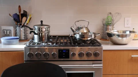 Panning alongside a kitchen with stove, sink Stock Footage 200970140