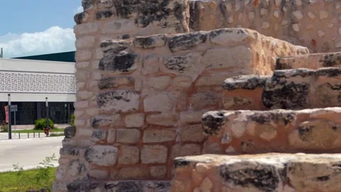 Panning from ancient Mayan pyramid steps to the modern Maya Train station in 스톡 동영상 335281083