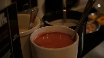 Panning and pulling focus down the salad bar showing the options and toppings Stock-Footage 85843435