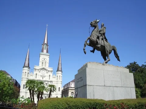 Panning around the Andrew Jackson statue and St. Louis Cathedral in New Orleans Stock Footage 81157767