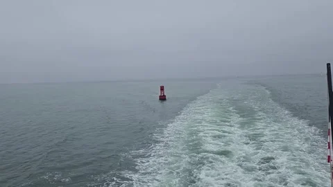 Panning Away Single Red Buoy in San Diego Bay on Foggy Day Stock Footage 327687634