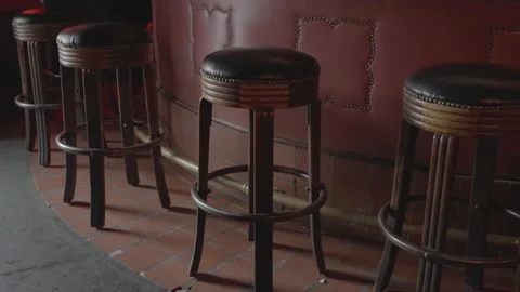 Panning bar stools in dive bar Stock Footage 217813741