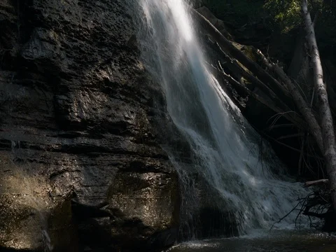 Panning up from Base of Brandywine Falls Waterfall Stock Footage 77156344