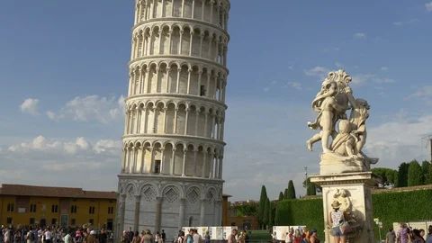 Panning up from base of Pisa Leaning Tower in Italy Tuscany with statue 4k Video stock 93452615