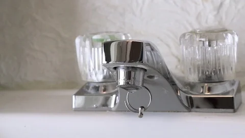 Panning of Bathroom Faucet Stock Footage 101672342