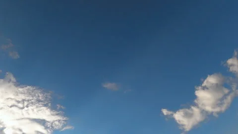 Panning beautiful blue clear sky with clouds in daytime on sunny day in summer Stock Footage 241890292