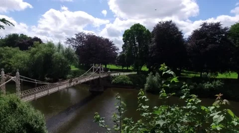 Panning of beautiful view over the River Wye and Victorian suspension footbridge Stock Footage 65742514