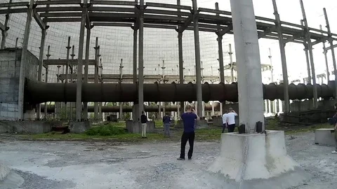 Panning bottom inside of nuclear reactor with tourists Stock Footage 76923244