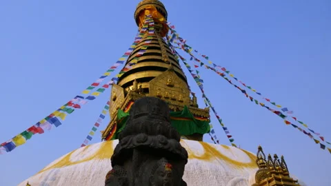 Panning from Buddha statue to UNESCO world heritage site Swayambhunath Stupa Stock Footage 285817223