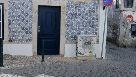 Panning up of building facade covered in beautiful blue Portuguese style azulejo Stock Footage 112031689