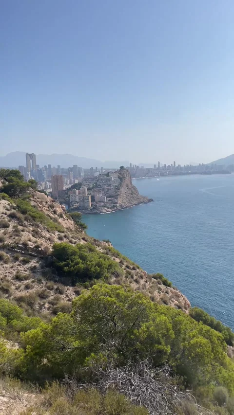 Panning at Cala de Finestrat and Benidorm from a Mountain Hiking Trail. Concept Stock Footage 252880751