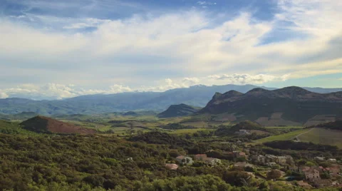 Panning camera, Clouds passing over mountains &amp; valley Time-Lapse Stock Footage 40201456
