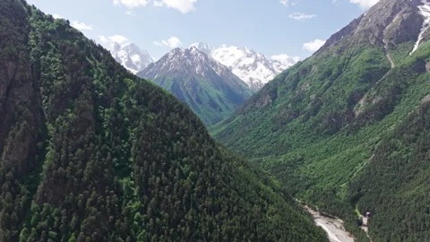 Panning camera movement showcasing a scenic mountain valley Stock Footage 289662285