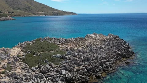Panning camera movement showcasing a stunning rocky coastline Video stock 286058092