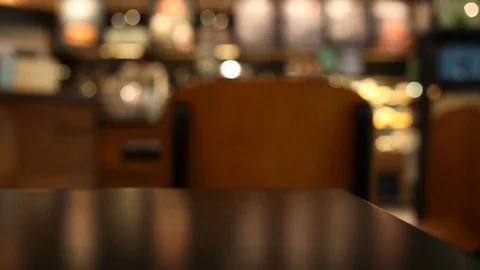Panning camera on the table at cafe blurred background Stock Footage