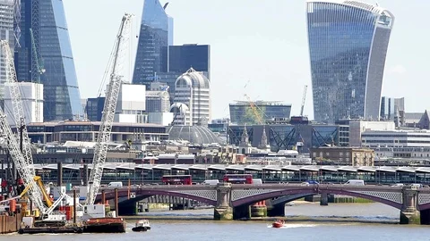 Panning of cityscape of Thames River construction cranes, London Stock Footage 96717337