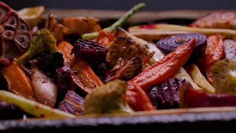 Panning Close Up of Appetizing Roasted Vegetables for Sunday Roast Stock Footage 326321307