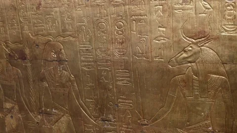 Panning close up of engraving on a panel from the tomb of tutankhamun in egypt Stock Footage 76107131