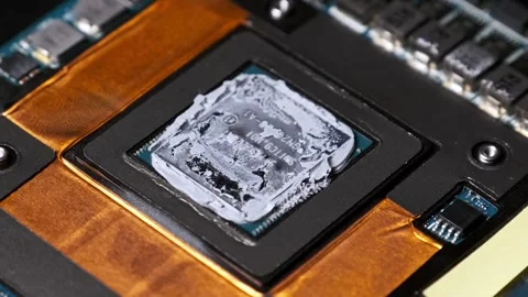 Panning Close-up of a Graphics Chip with Thermal Compound Stock Footage 314013313