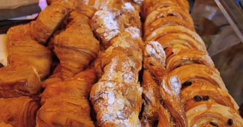Panning close up view of a display of French pastries Stock Footage 69805245