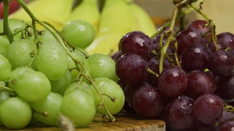 Panning, closeup shot from right to left on green and red grapes Stock Footage 341221849