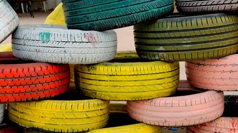 Panning on colorful old tyres. Stock Footage