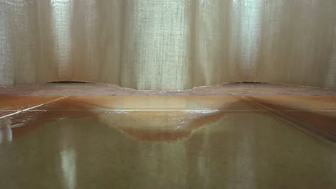 Panning in the curtain of a window with the light coming through Stock Footage 143095550