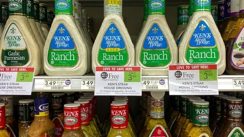 Panning down on bottles of Kens Salad Dressing at a Publix grocery store. Stock Footage 156941679
