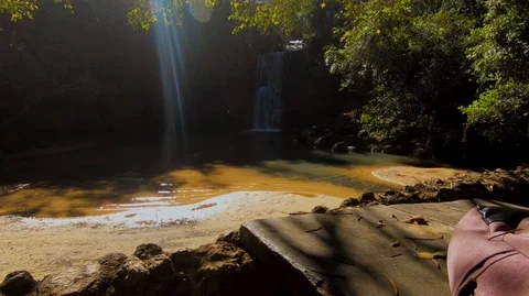 Panning down close up of backpack with Waterfall Stock Footage 115087838