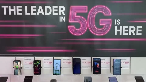 Panning down on a display of Google, Apple, Samsung, Moto, OnePlus, Alcatel,  Stock Footage 163992272