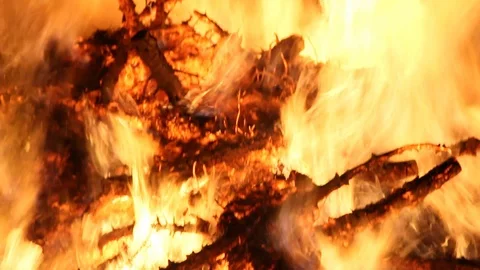 Panning down from ember to flames to wood Stock Footage 122306735