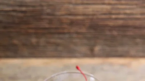 Panning down on an old fashioned cocktail drink Stock-Footage 73753772