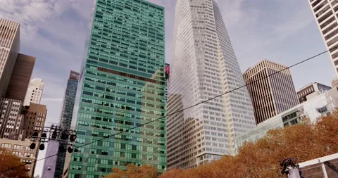 Panning down from Skyscraper in NYC to bryant park ice skating ring Stock Footage 219893309