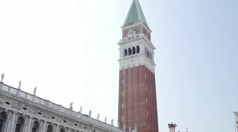 Panning down video of San Marco Companile (tower) to crowded Saint Mark's Square Stock Footage 68535776