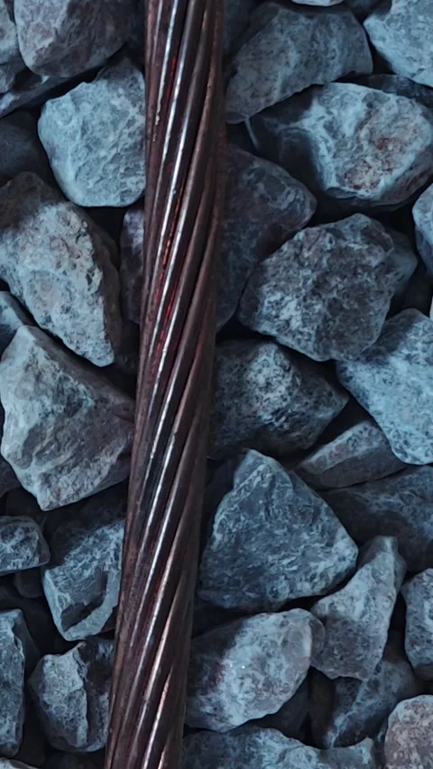 Panning down video of a thick bare stranded copper grounding wire laying. Stock Footage 339022338