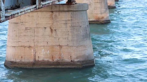 A panning down view to the water of the Bahia Honda Bridge Stock Footage 164615545