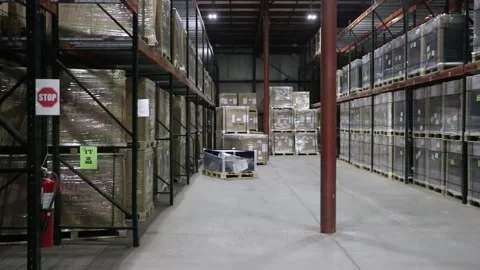 Panning down a warehouse aisle Stock Footage 146616045