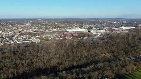 Panning Drone Aerial Over Highway, Industrial Town, Power Plant in Fall Winter Stock Footage 121237691