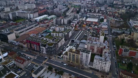 Panning drone movement over the Paris densely inhabited area with buildings and Stock Footage 302564495