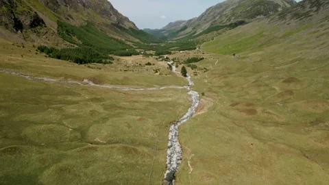 A panning drone shot of a valley within the Lake District. Stock Footage 253553019
